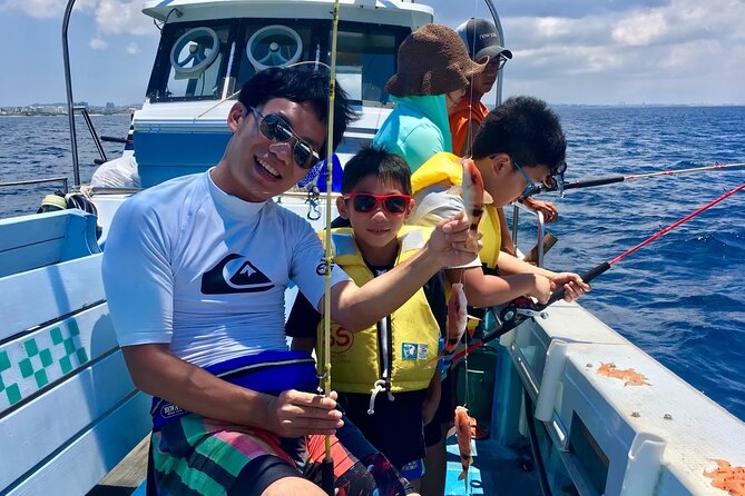 2 hours family fishing in Okinawa - The boat ride out: life jackets, quick instructions, and Okinawa coast views