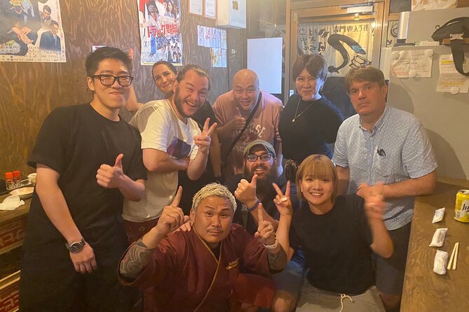 Hungry Osaka Street Food Tour:15 Tastings & 3 Drinks with a Local - Shinsekai at night, with the Tsutenkaku spotlight