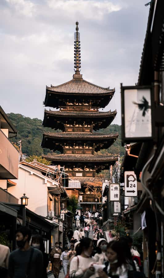 Kyoto: Gion Geisha District with Souvenir and Snack - Meeting at Shijo Dori, crossing Kamo River, and setting the mood