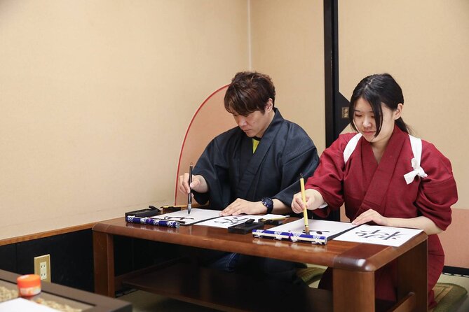 Learning Zen of Japanese Calligraphy in kimono near Osaka Castle - The Teacher Surprise: Your Name in Kanji on Wooden Tags