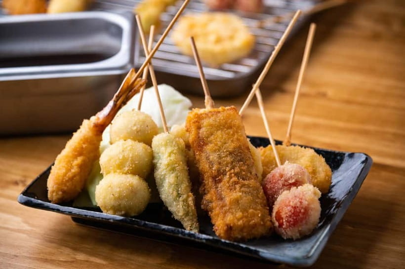Osaka: Food Tour Kuromon Market & Dotonbori with Guide - Egg Tart custard tarts for the sweet, creamy finale