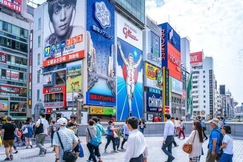 Osaka: Food Tour Kuromon Market & Dotonbori with Guide - Dotonbori neon streets, Ebisu Bridge, and the Glico sign photo