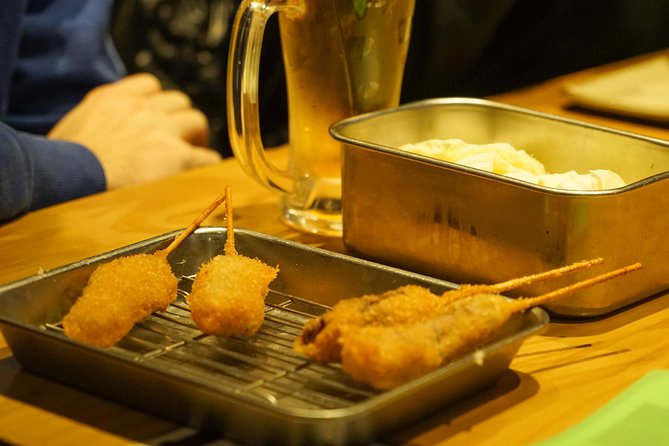 Osaka Local Foodie Walking Tour in Dotonbori and Shinsekai - Shinsaibashi-suji and the Billiken-style pause