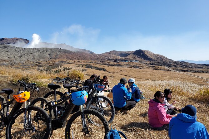 Private E-MTB guided cycling around Mt. Aso volcano & grasslands - Nakadake Crater: close smoke and real crater scale