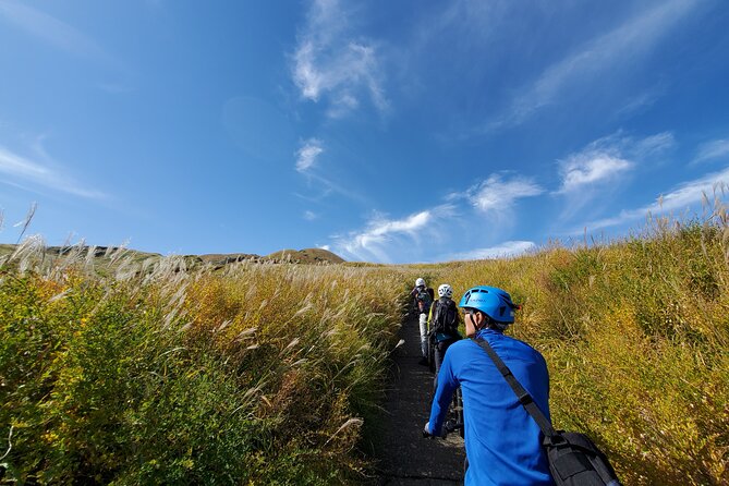 Private E-MTB guided cycling around Mt. Aso volcano & grasslands - The descent: caldera open, then grassland time