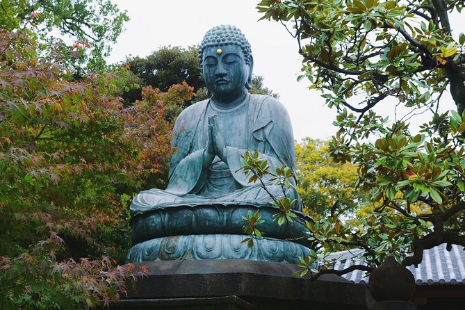 The Old Quarter of Tokyo - Yanaka Walking Tour - The 100-year-old cyder tree and a Yanaka symbol pause