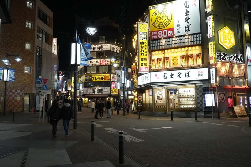 Tokyo: Shibuya Food Tour, Neon Lights & Local Flavors - Hidden Onigiri Stop and a Cozy Café Reset